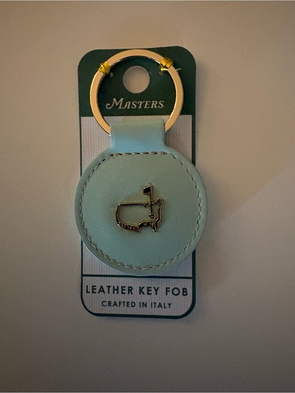 Masters Tournament Round Leather Key Fob in Pale Blue with Gold Accent Brand New